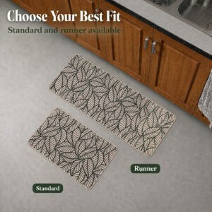A beige leaf-print kitchen mat and longer runner shown together on the floor, illustrating the standard and runner size options.