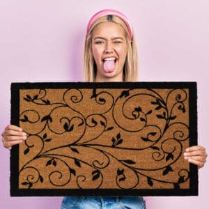 woman with the coir doormat in her hands