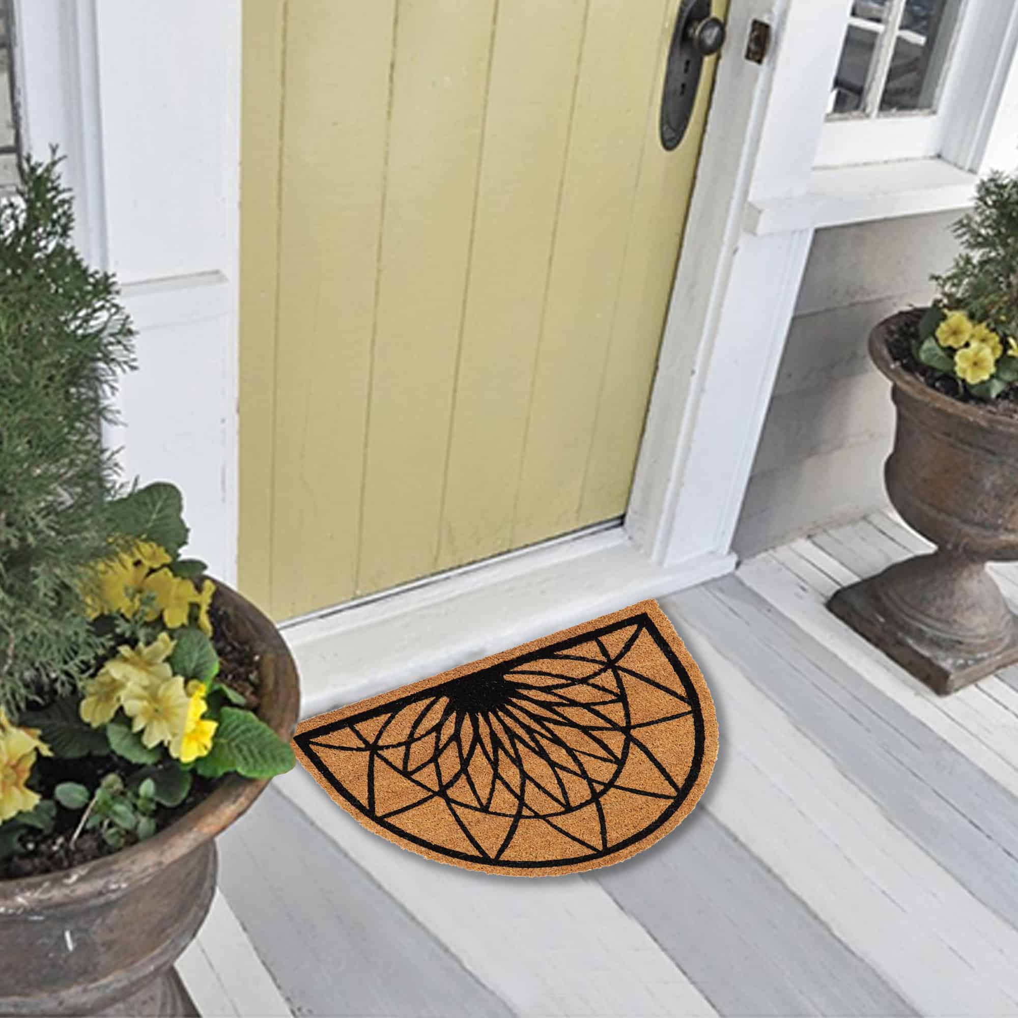 an entrance door with the coir doormat placed in front of the door