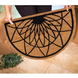 someone holding the mat to show the size and design