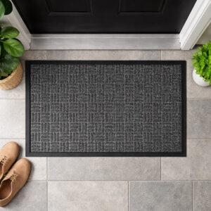 Gray checkerboard doormat viewed from above at front door entry