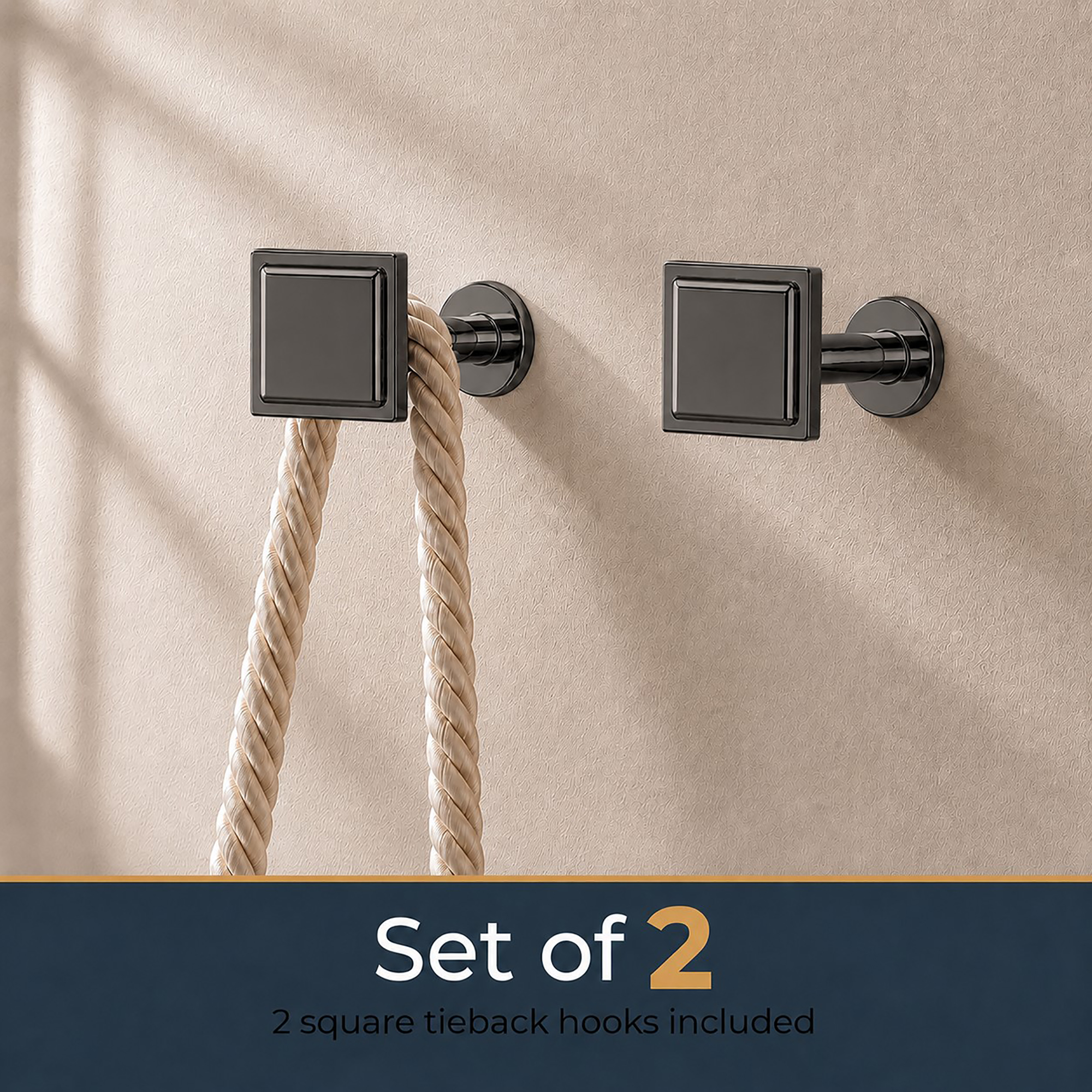 Set of 2 graphite square curtain tieback hooks mounted on a beige wall, one holding a rope tieback