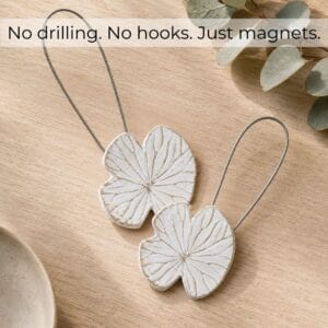 Flat-lay bois: Set of 2 white water lily magnetic curtain tiebacks on light wood, no drilling no hooks just magnets