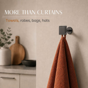 Graphite square wall hook holding a rust orange kitchen towel, also holds robes, bags and hats