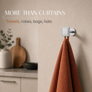 Chrome square wall hook holding a rust orange kitchen towel, also holds robes, bags and hats