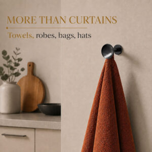 Graphite round wall hooks holding towels and robes in a bathroom, beyond curtain use