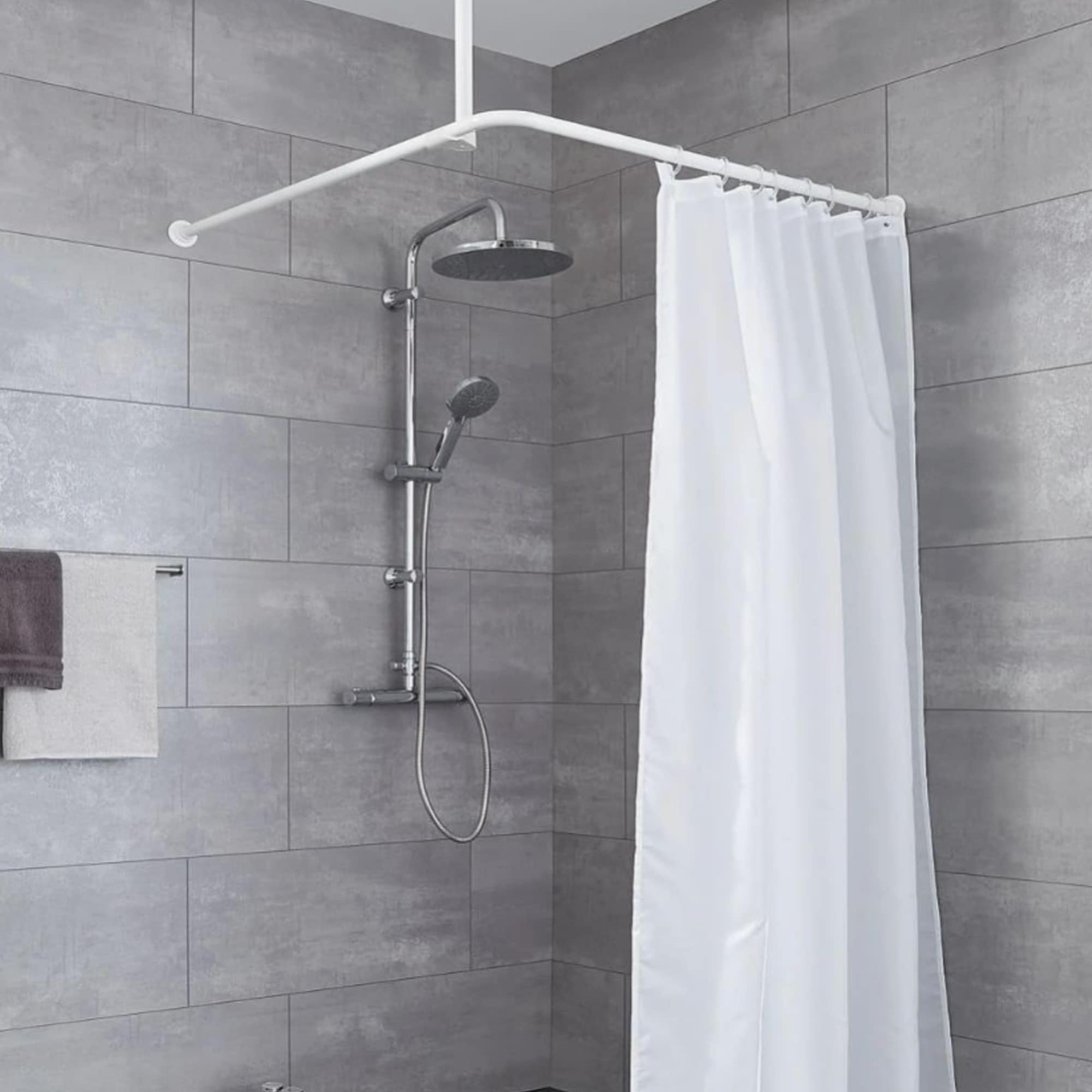 White ceiling support rod installed in a gray tiled bathroom with a white shower curtain