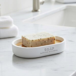 White soap dish with bamboo insert on marble bathroom counter