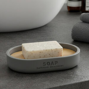 Matte gray soap dish with bamboo base holding bar soap