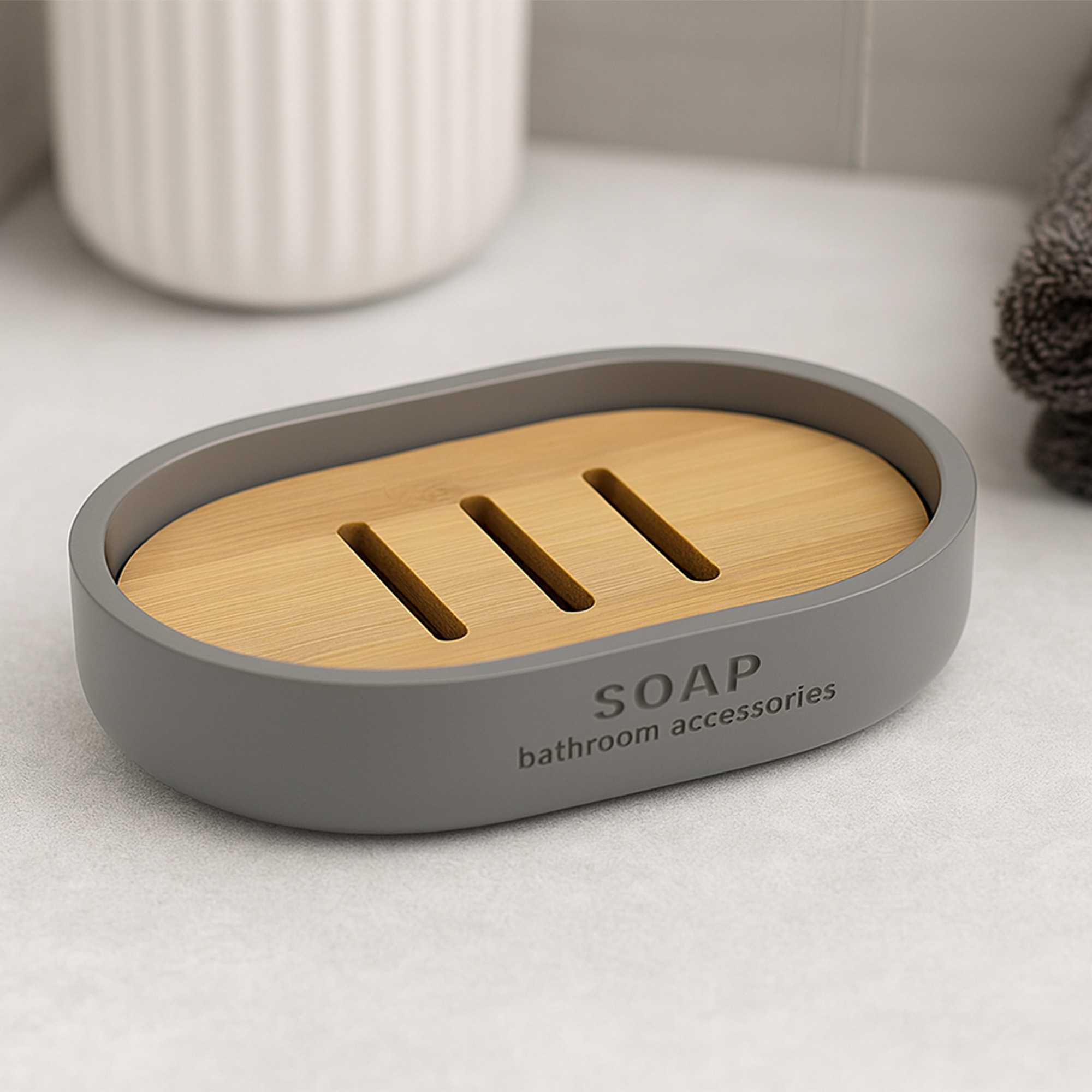 Gray soap dish with bamboo insert on stone countertop