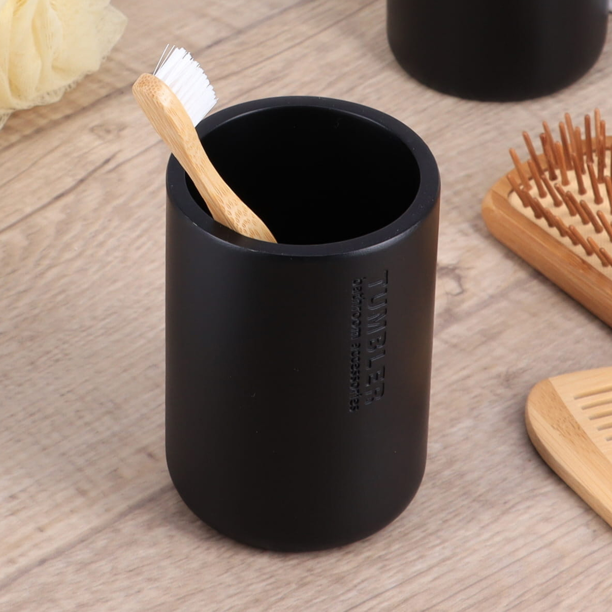 Minimalist matte black tumbler with engraved text close-up