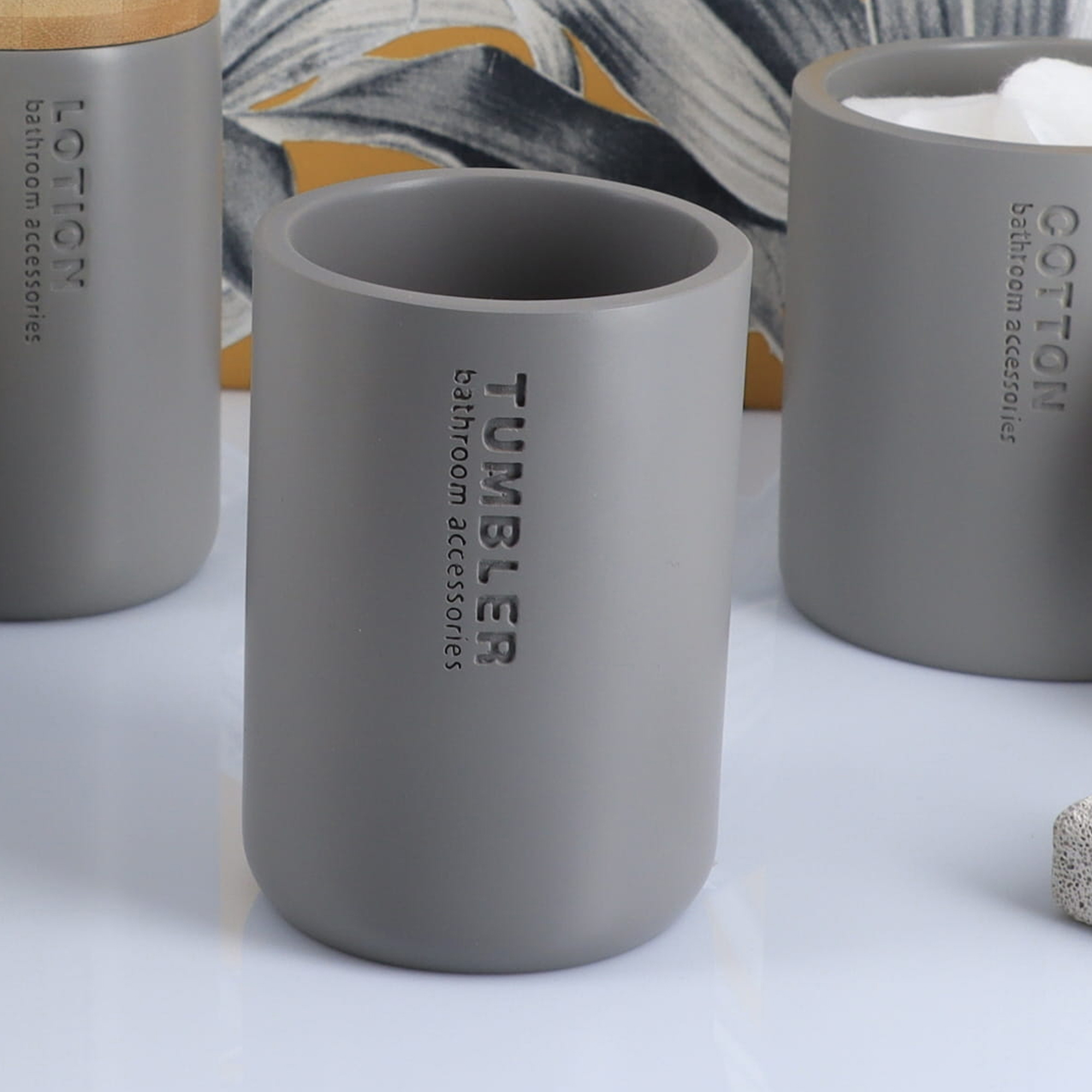 Minimalist matte gray tumbler with engraved text close-up