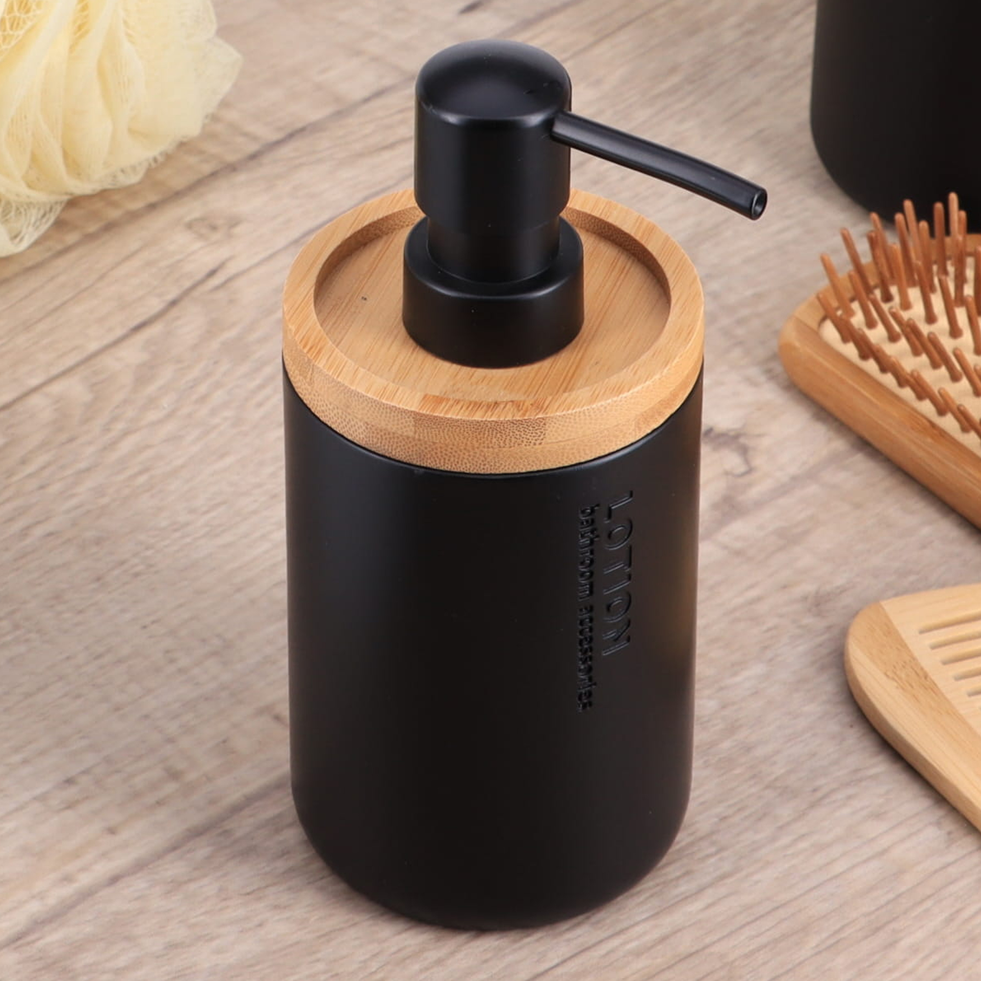 Black dispenser styled on a wooden counter
