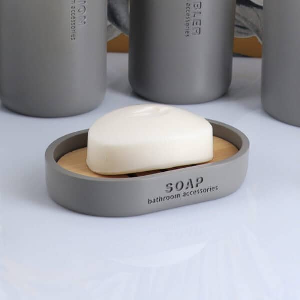 Gray oval soap dish with slotted bamboo insert close-up