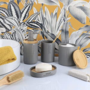Matching gray bathroom accessories set with soap dish dispenser