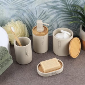 Complete bathroom set featuring a beige dispenser with natural accents