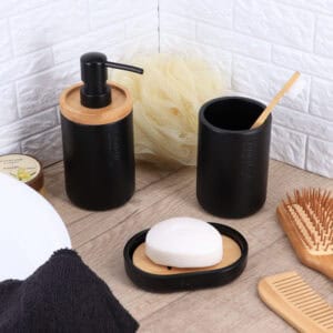 Complete bathroom set featuring a black dispenser with natural accents