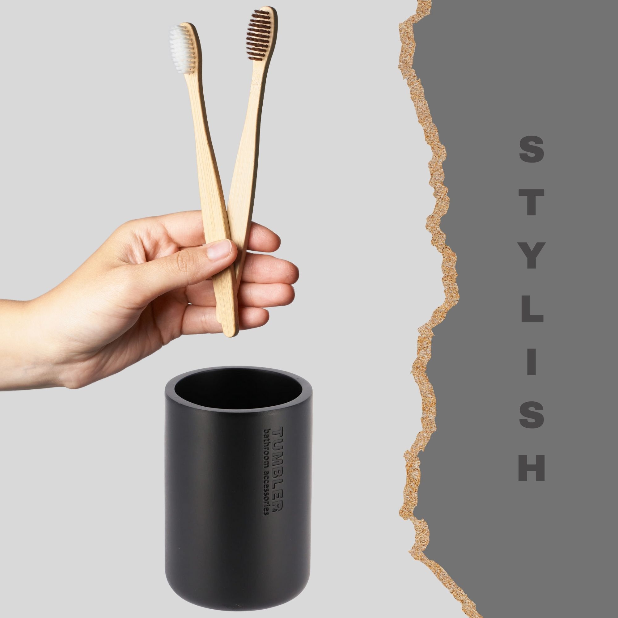 Black toothbrush holder with bamboo brushes in modern bathroom