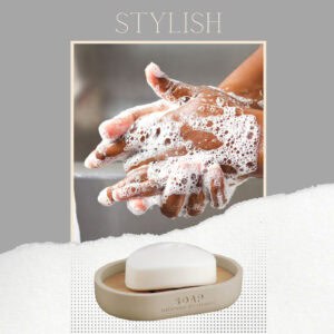 Close-up of hands being lathered with soap, emphasizing the stylish beige soap dish with bamboo insert used for convenience and elegance.