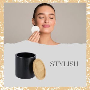 Stylish promotional image showing woman using cotton pad with matte black bamboo-lid storage jar