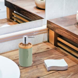 Green dispenser blending into a rustic wooden bathroom decor