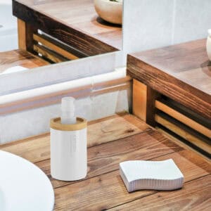 Close-up of white soap dispenser highlighting its modern design