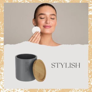 Stylish promotional image showing woman using cotton pad with matte gray bamboo-lid storage jar
