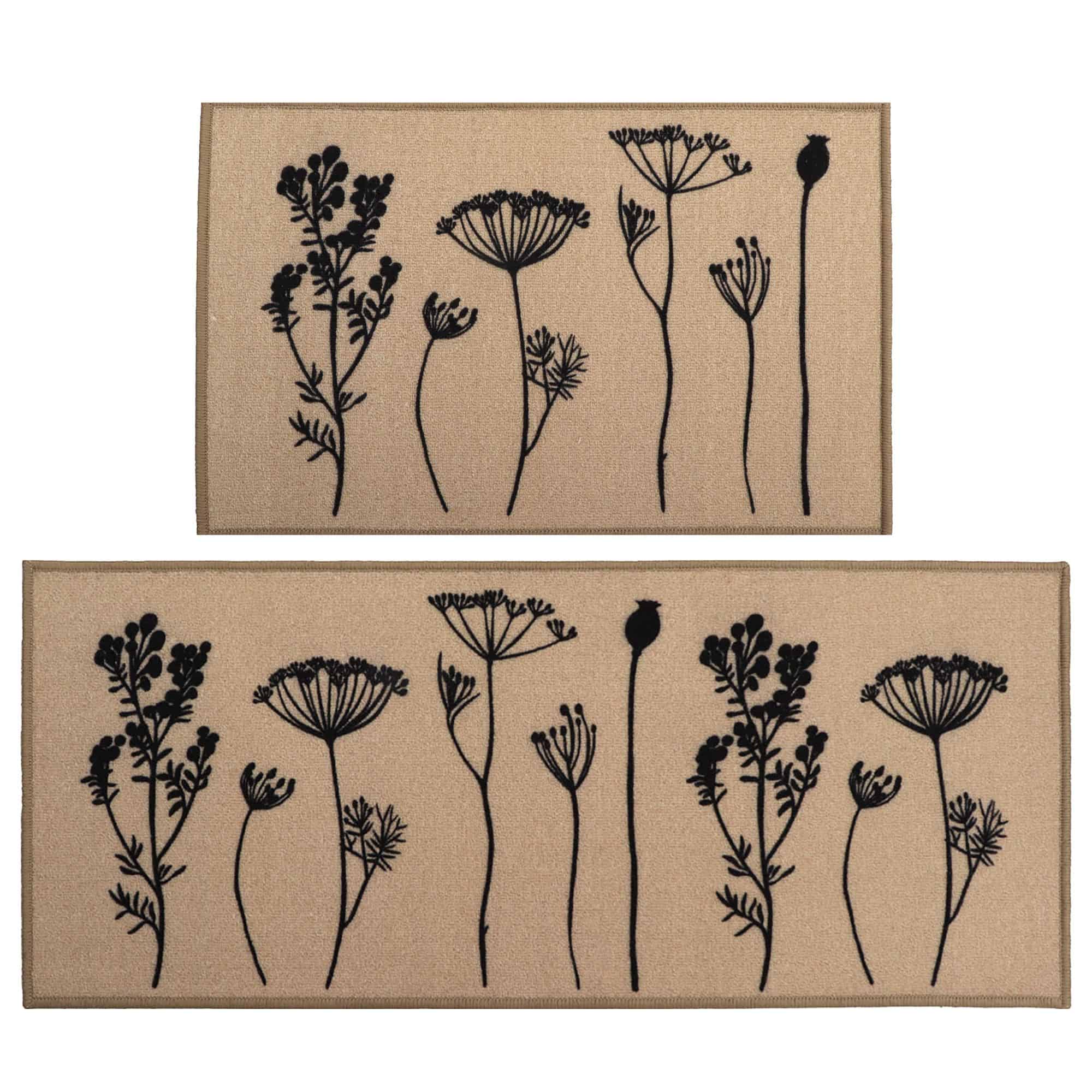 Two piece floral kitchen rug set in natural beige with black wildflower and seed head silhouettes, a mat and a longer runner shown flat on white.