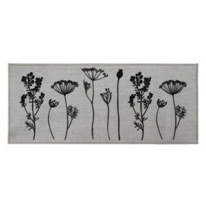 Gray floral kitchen runner rug with black botanical stem print of wildflowers and seed heads displayed flat against a soft gray background.