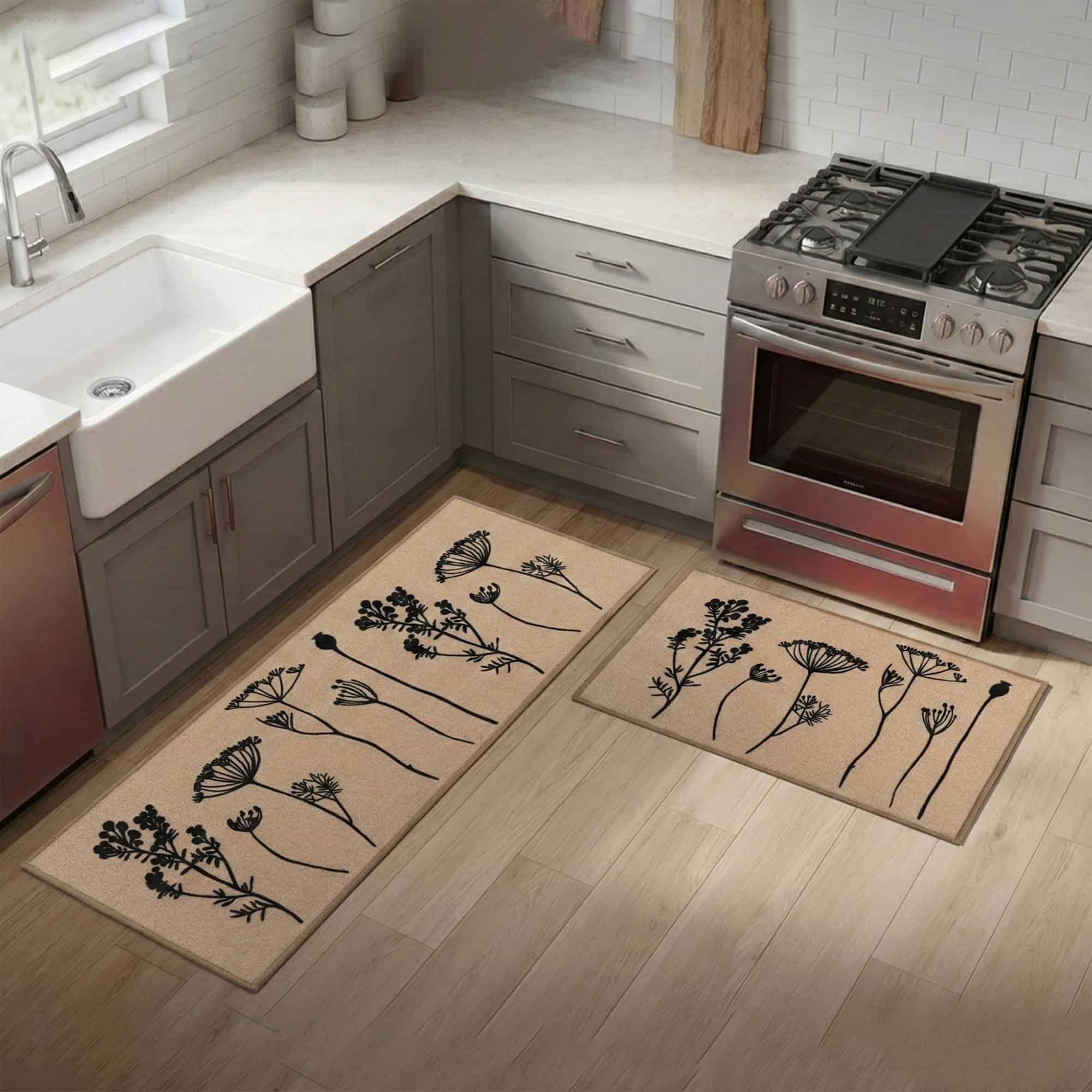 Natural beige floral mat and runner set on hardwood beside a farmhouse sink and stove, black botanical stems warming a bright modern kitchen.