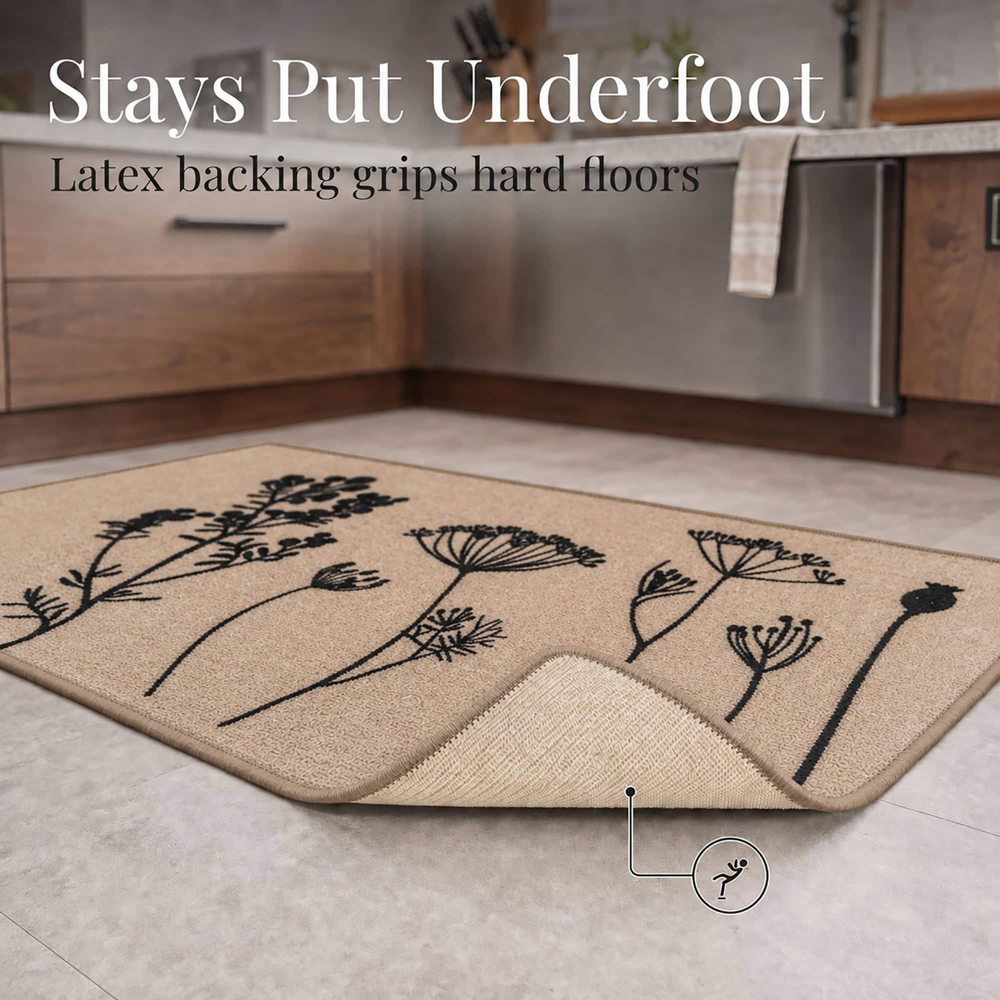 The natural beige floral rug is lifted at one corner to reveal the latex backing that grips hard floors and helps prevent slips underfoot.