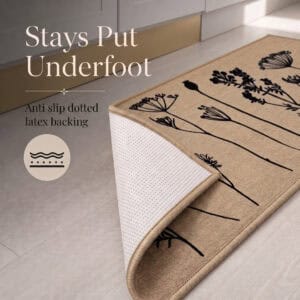 Natural beige floral kitchen runner with one corner folded back to reveal the anti slip dotted latex backing that grips hard floors.
