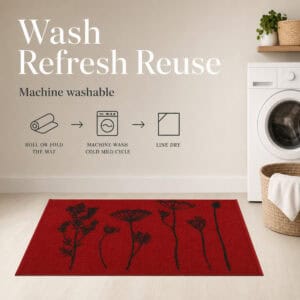 Red floral kitchen mat in a laundry room with icons showing it can be rolled machine washed on a cold cycle and line dried.