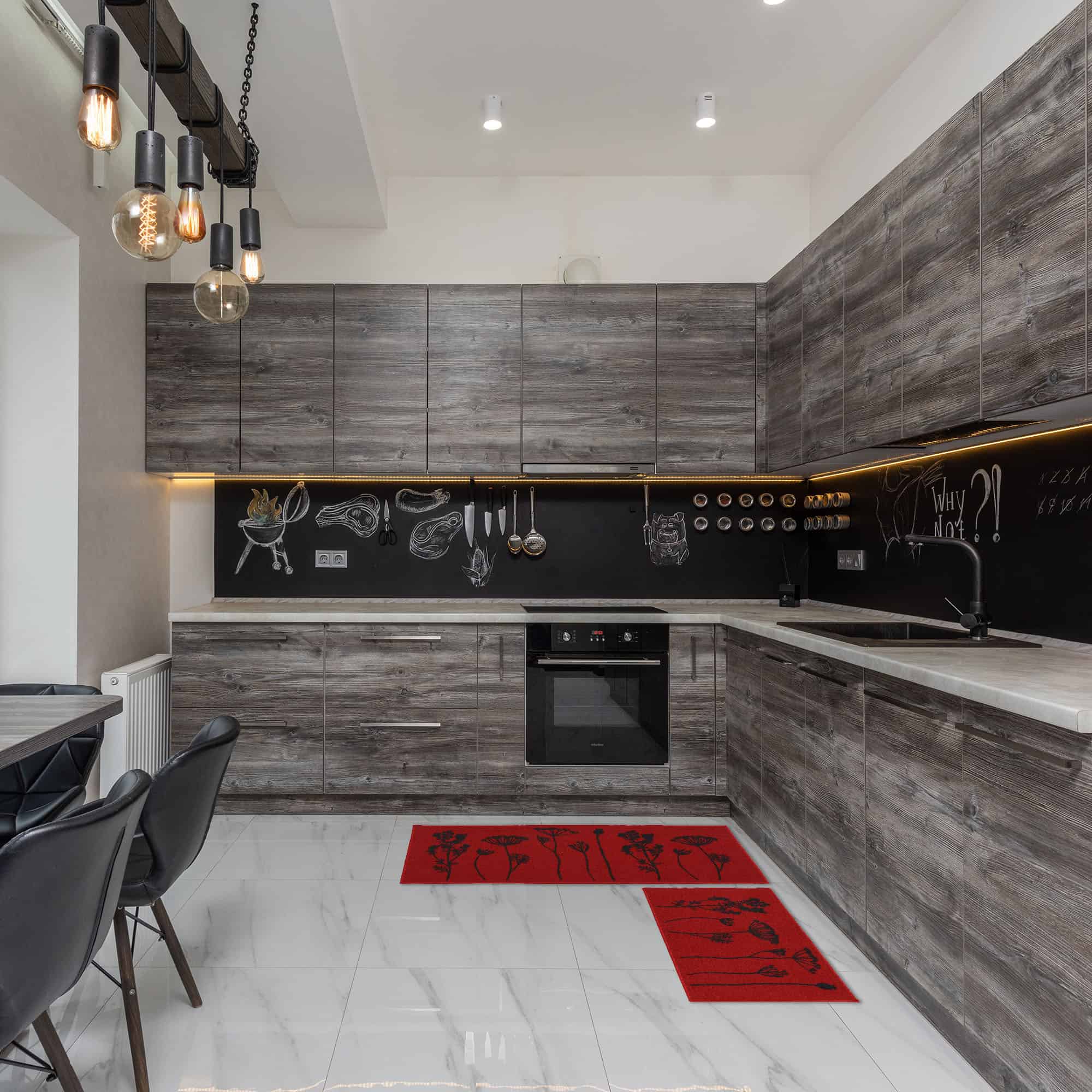 a modern black and gray kitchen and a set of red kitchen rugs with botanical motifs