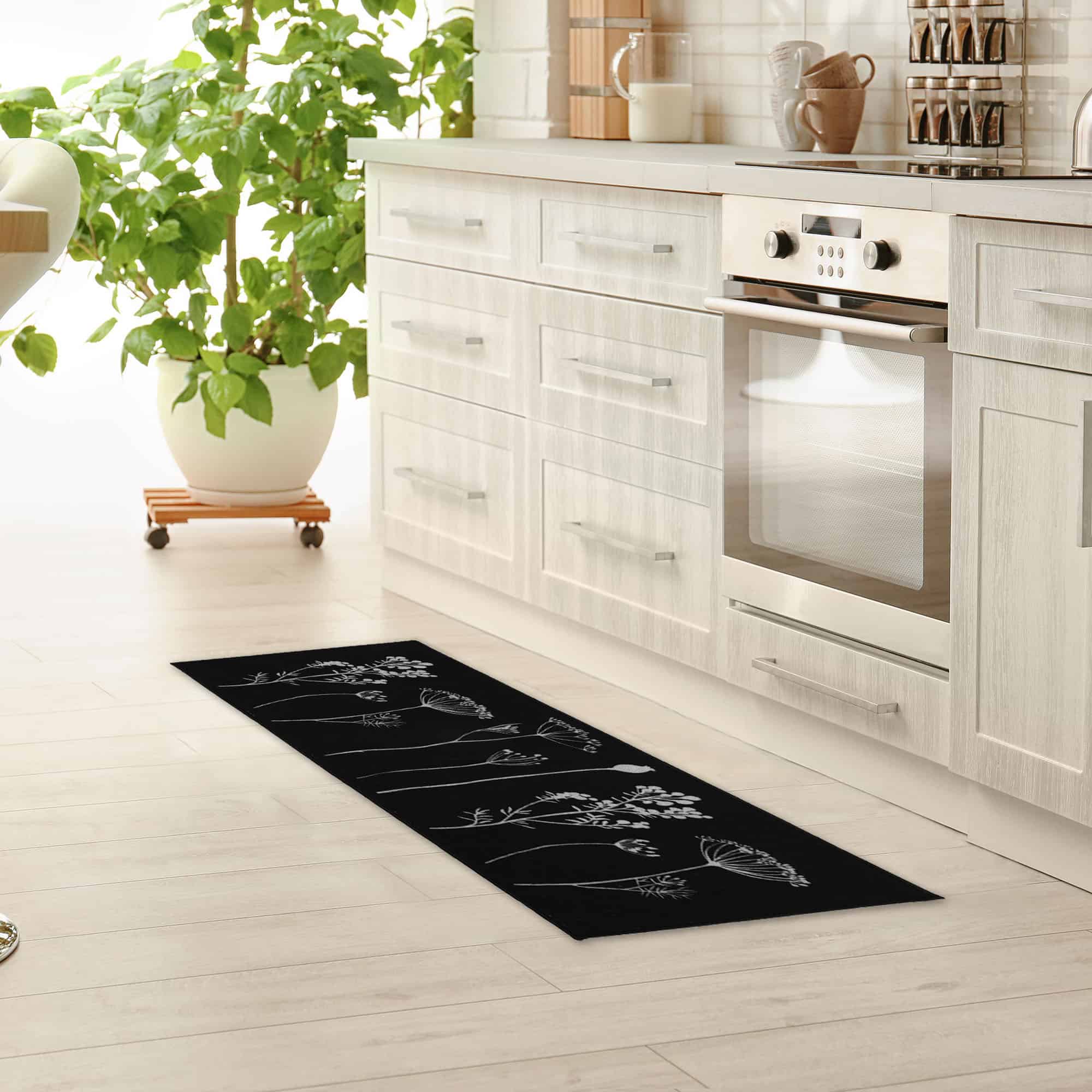 an elegant kitchen with a long runner rug in black with filed flowers design