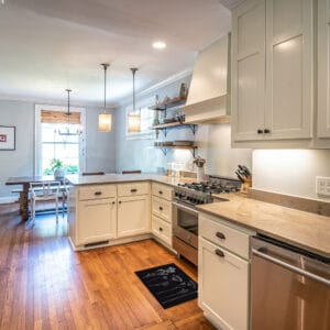 a traditional kitchen with wooden floor and a wool effect kitchen mat with flowers pattern