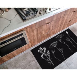 a beautiful black mat in a kitchen with gray floral design