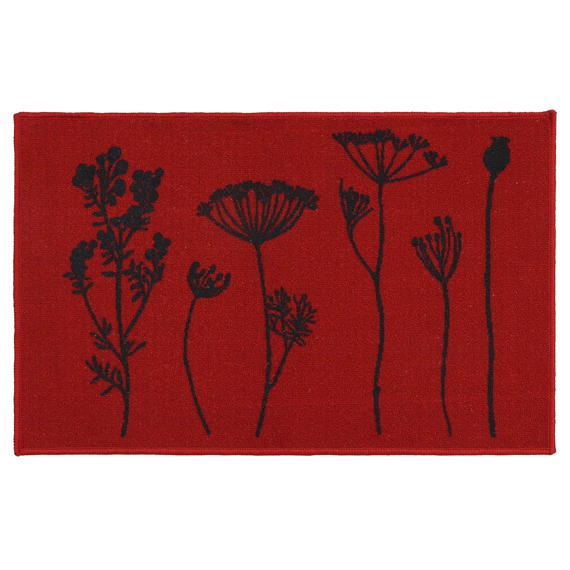 a red kitchen mat with a black wildflowers motif