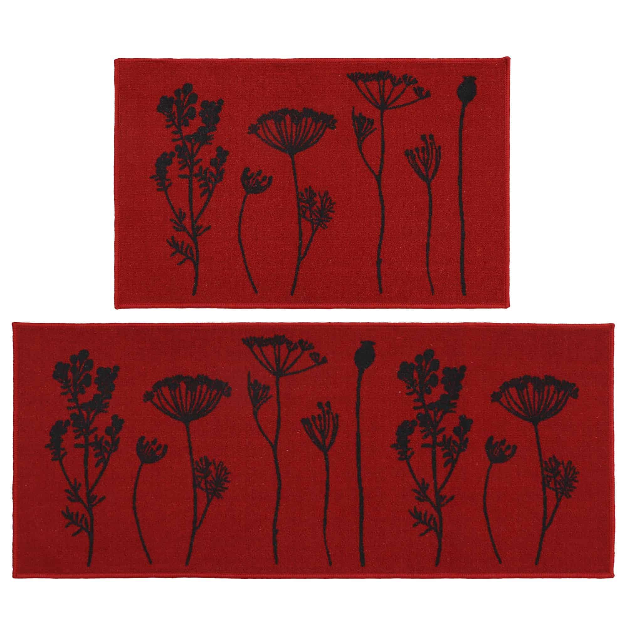 a set of red kitchen mat and runner rug with a black wildflowers motif