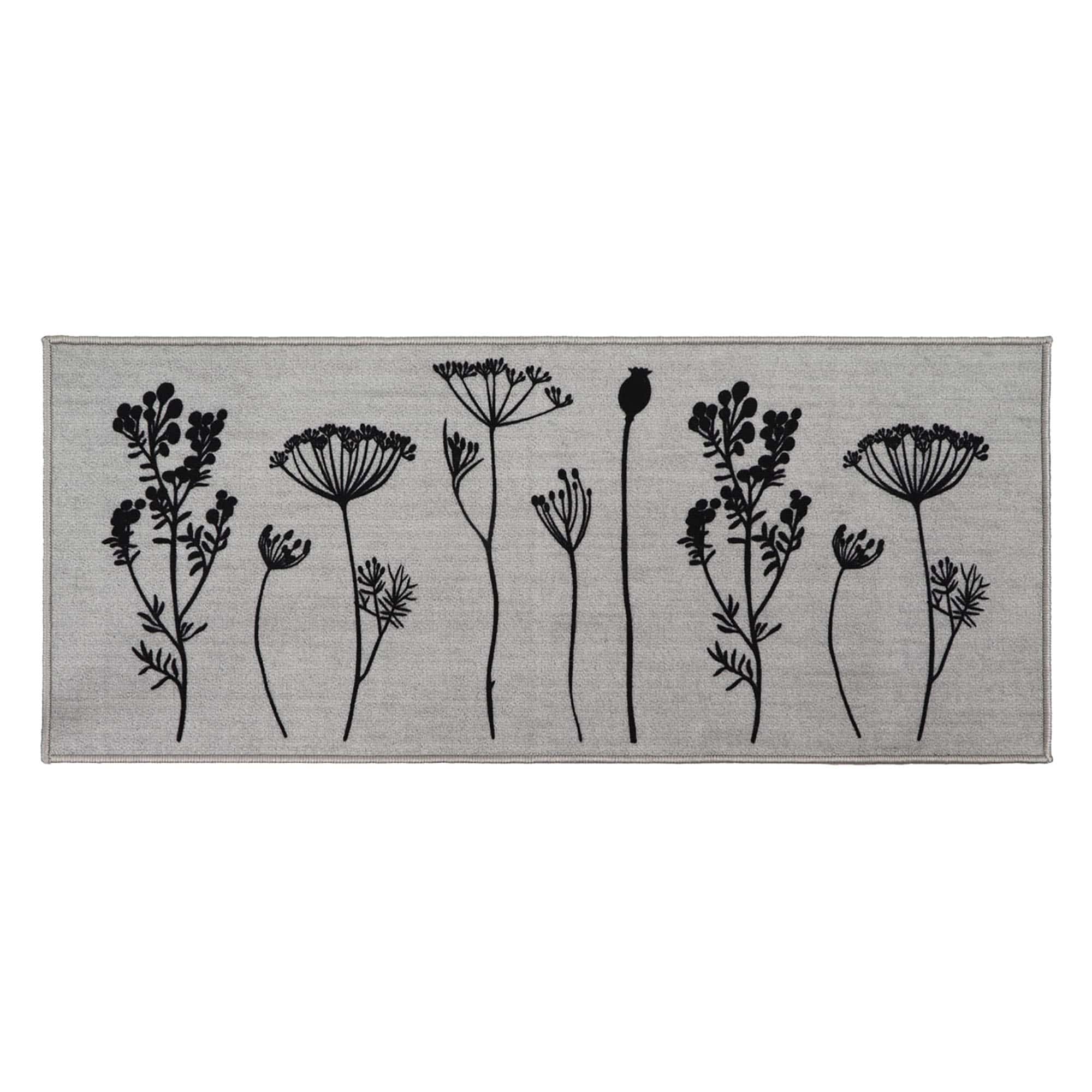 a gray kitchen runner mat with a black wildflowers motif