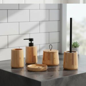 Natural bamboo bathroom accessory set with dispenser, tumbler, soap dish, cotton jar, and toilet brush on countertop