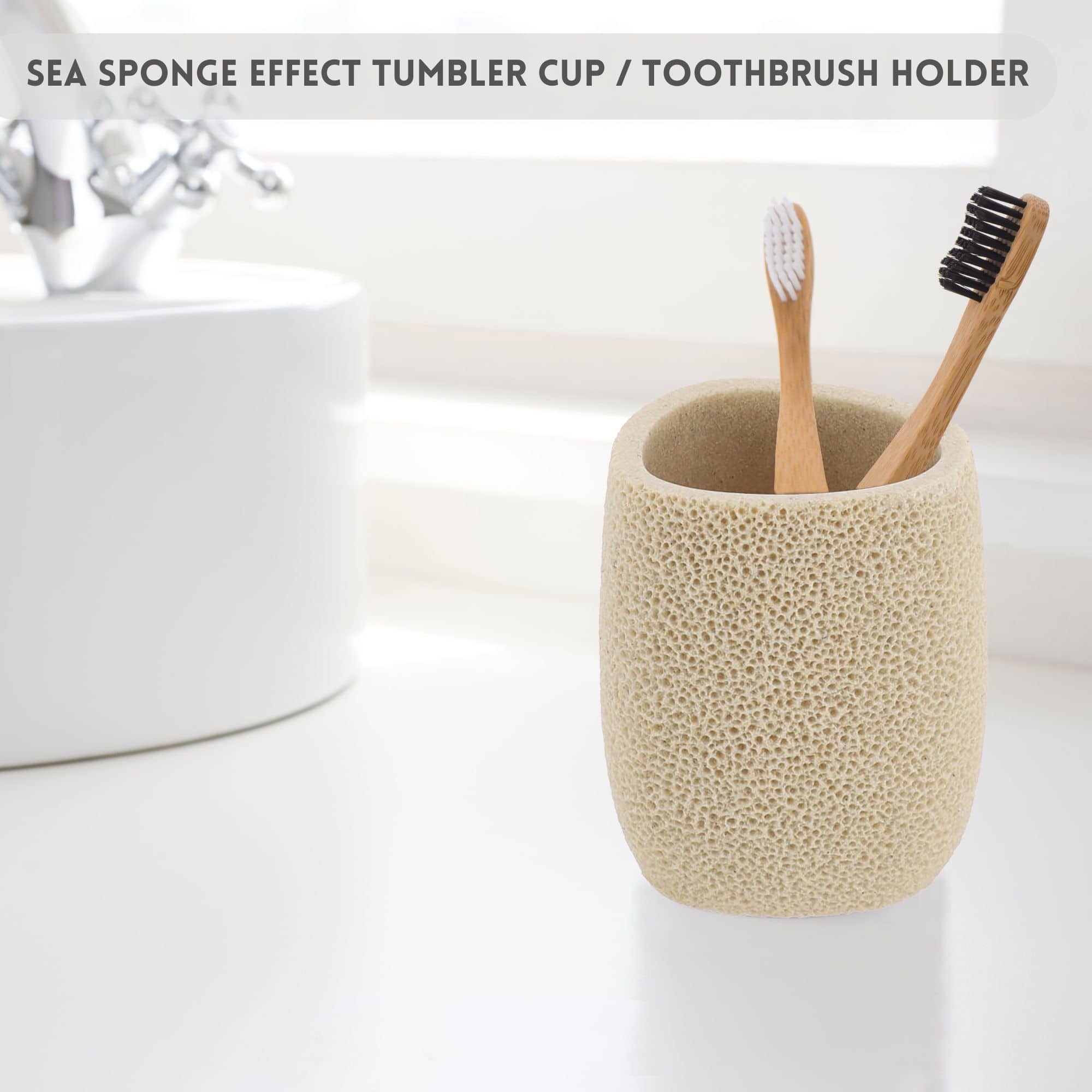 Tumbler cup/toothbrush holder on bathroom sink