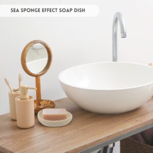Soap dish with soap bar on a bathroom countertop