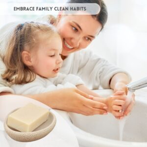 Mom and girl washing hands with the soap dish on the left
