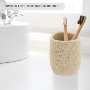 Tumbler cup/toothbrush holder on bathroom sink