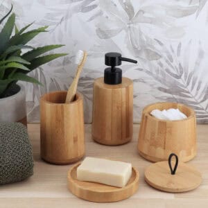Soap dispenser, soap dish, cotton ball holder, tumbler cup in bathroom environment