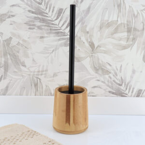 Toilet brush and holder standing on the floor in a cozy bathroom