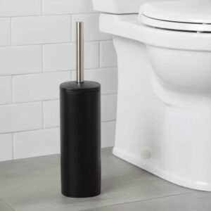 Matte black square toilet brush with stainless steel handle beside white toilet in tiled bathroom