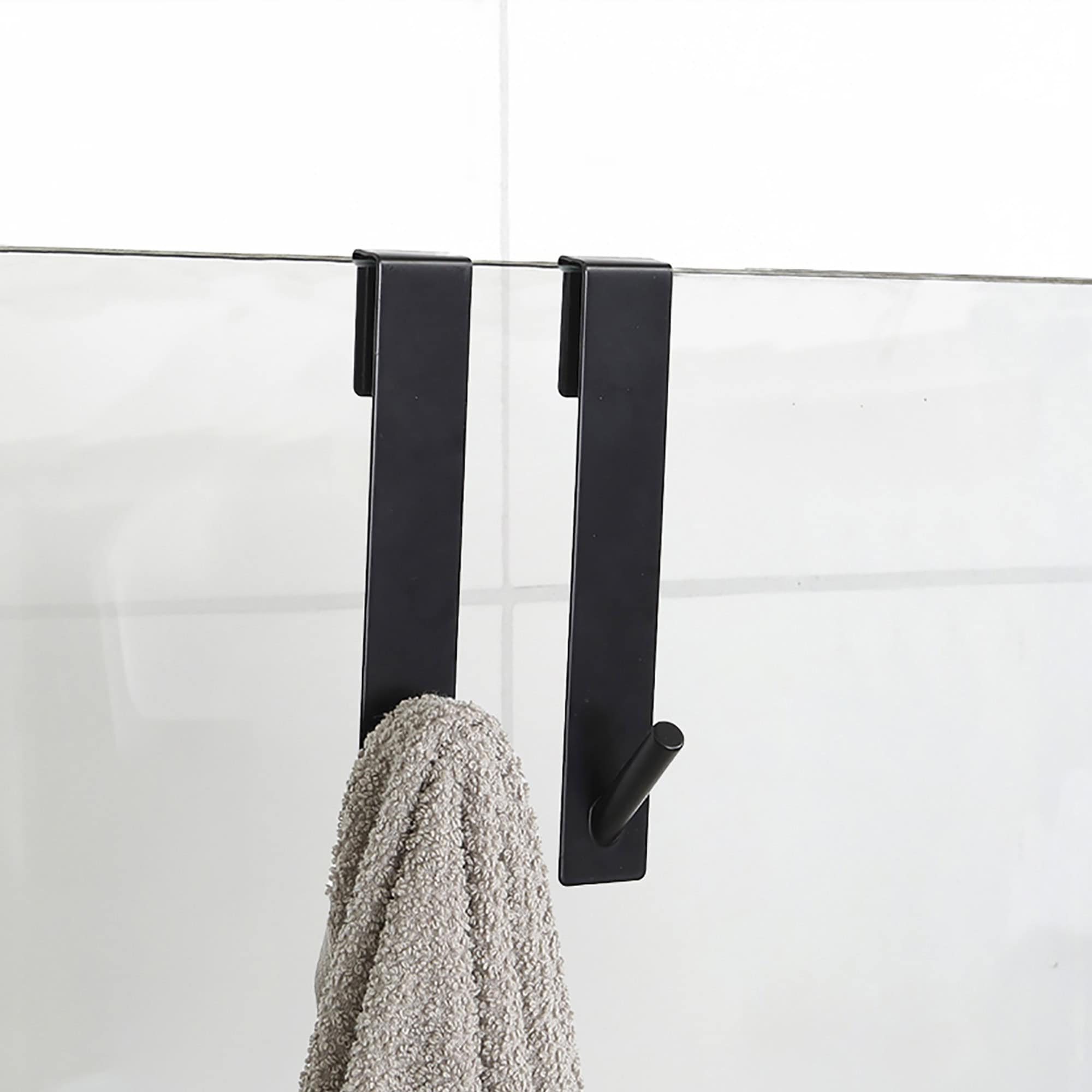 black shower hooks on frameless glass door