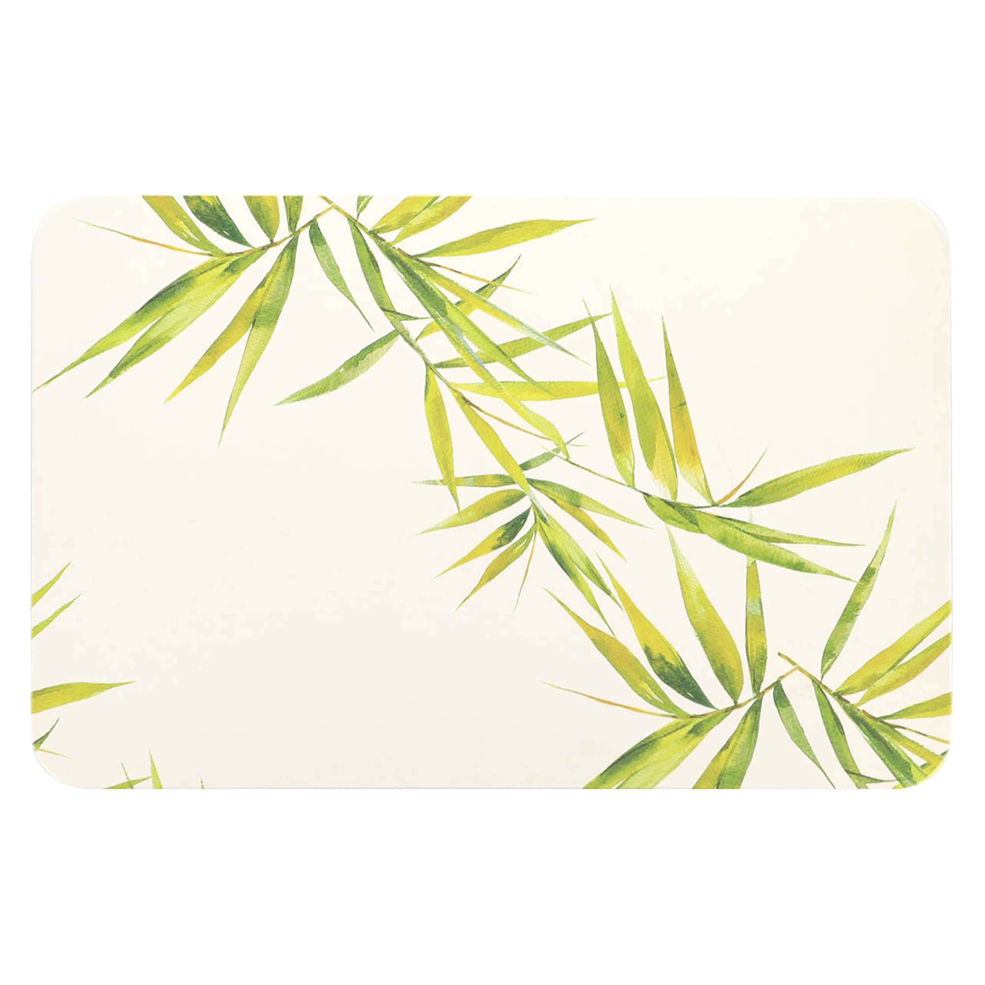 Close-up of a natural diatomite bath mat featuring green bamboo leaves on beige background